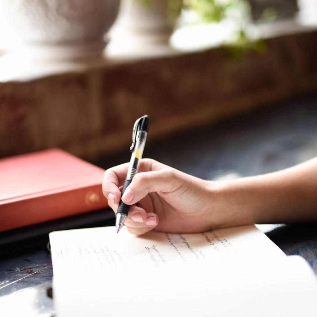 image of a person writing