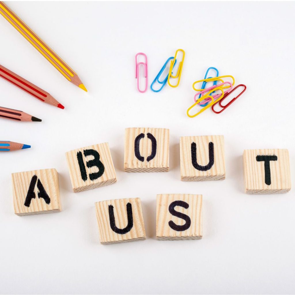 image of scrabble pieces spelling about us to illustrate why the about page of a service business website is important