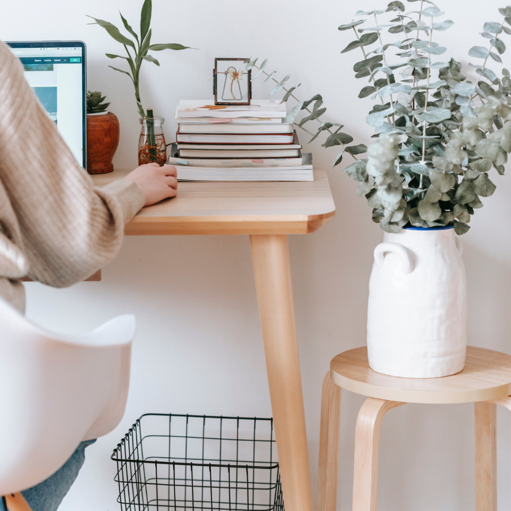 image of a person typing on a computer at a desk to illustrate why you need multiple service pages on your website